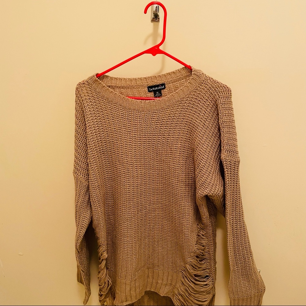 A cute tan sweater with cute little details On the sides very nice,comfortable